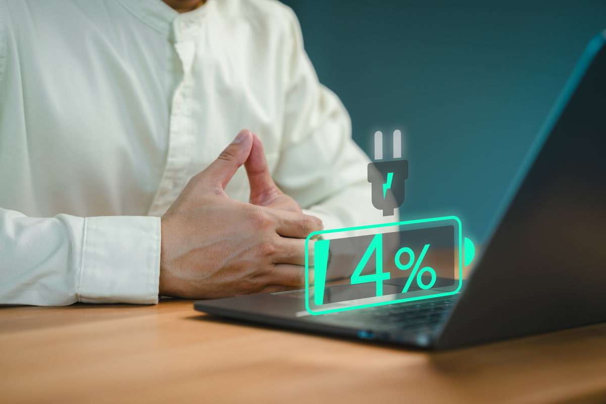 Can using a laptop while charging damage the battery?